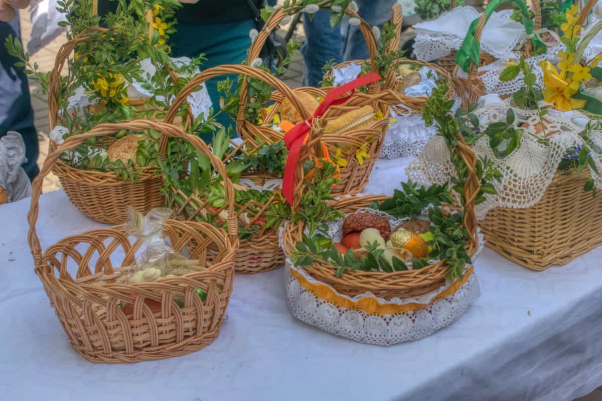 Food baskets set on a table prepared to be ordained, traditional custom on a large Saturday in Poland.