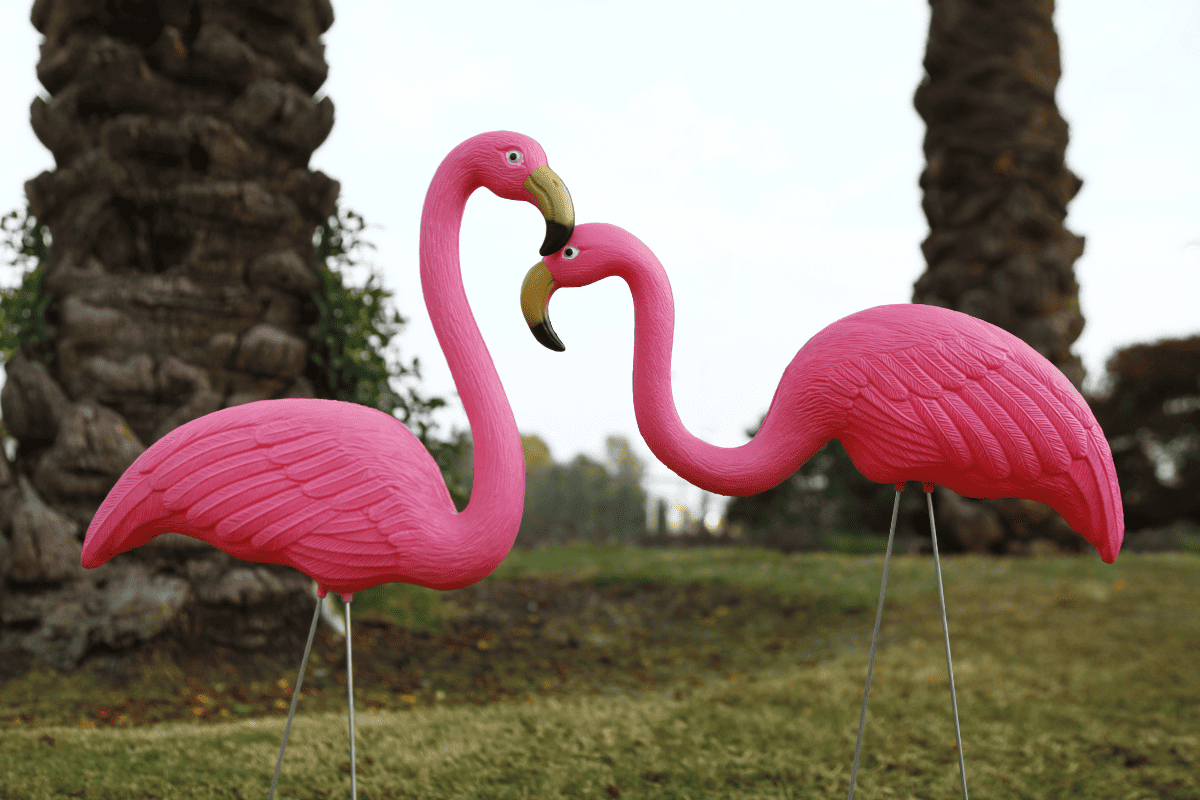 A pair of plastic flamingos in the garden