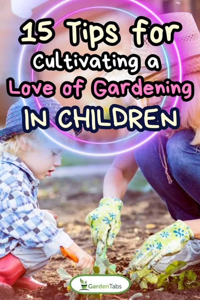 Child and his mother planting strawberry seedling into fertile soil outside in garden