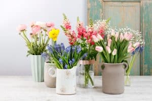 Spring flowers on wooden table. , The 13 Best Flowers for Cutting and Enjoying Indoors