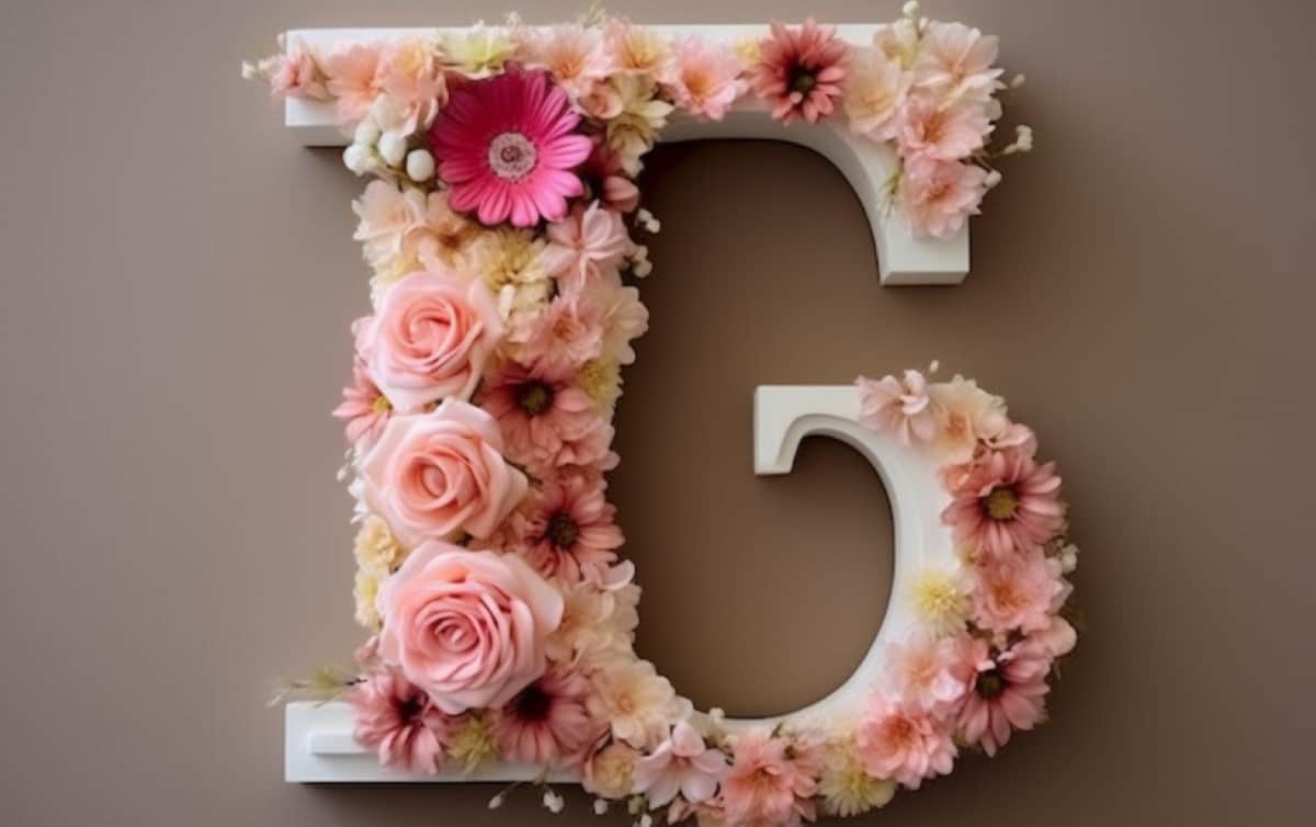 a personalized floral monogram by attaching fresh-cut flowers to a wooden or cardboard letter