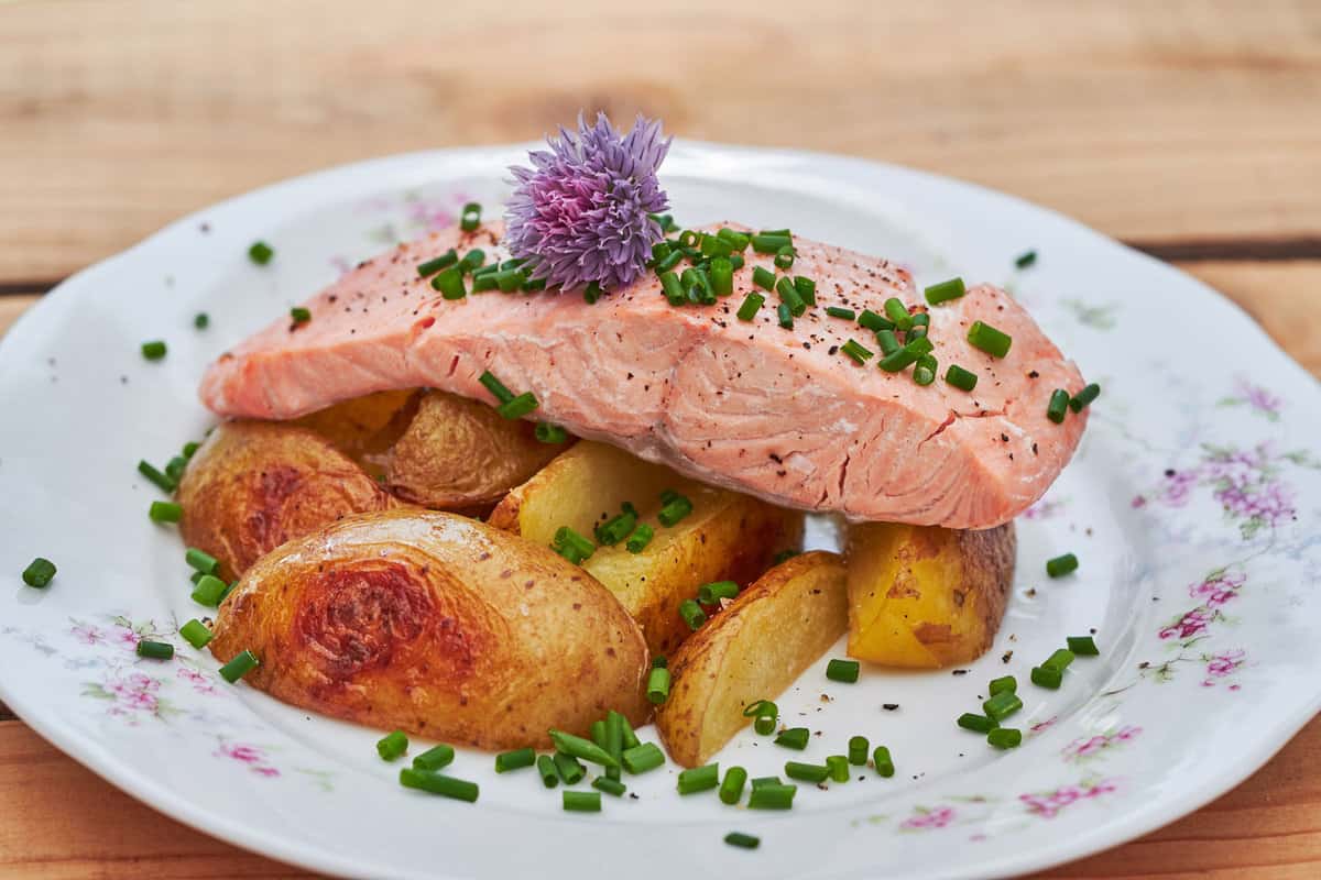 A salmon dish with Chive Blossoms