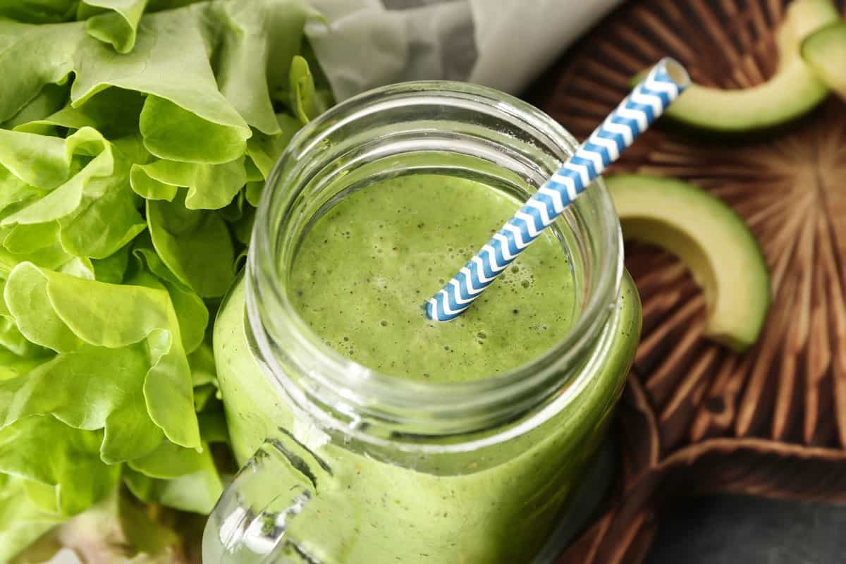 A delicious mason jar filled with lettuce smoothie