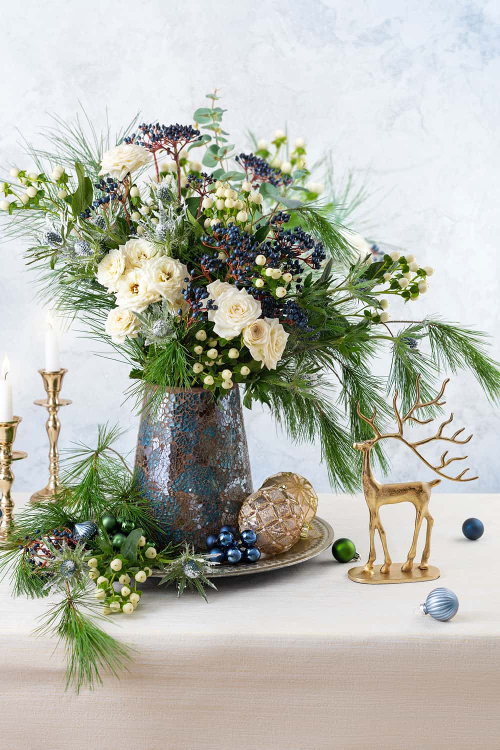 Christmas decorations, candles and flower bouquet