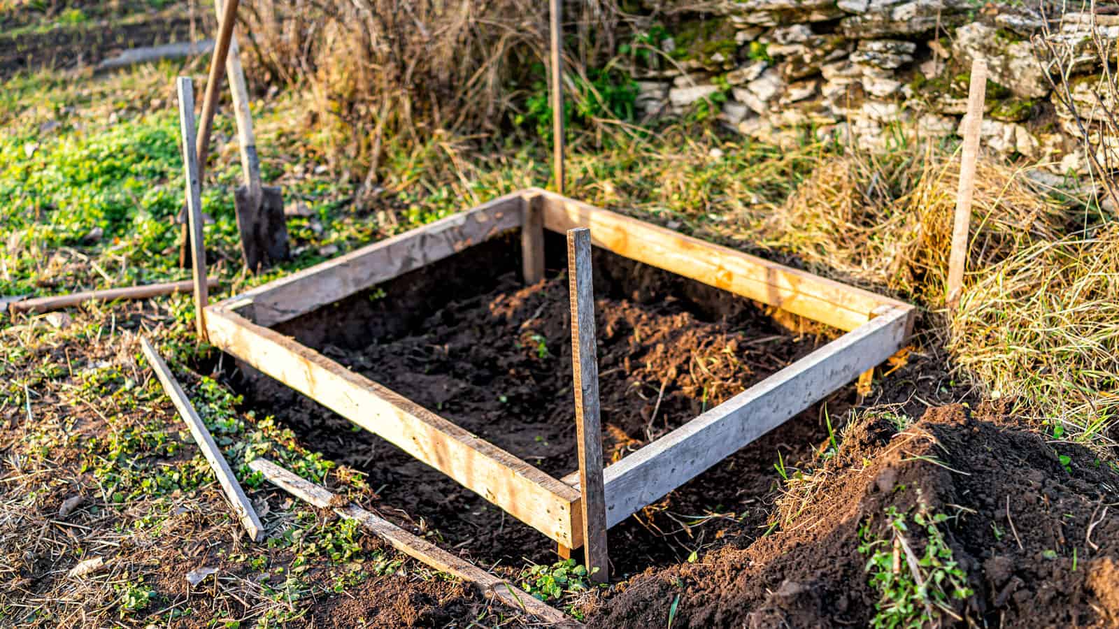 An unfinished DIY cold frame in the garden