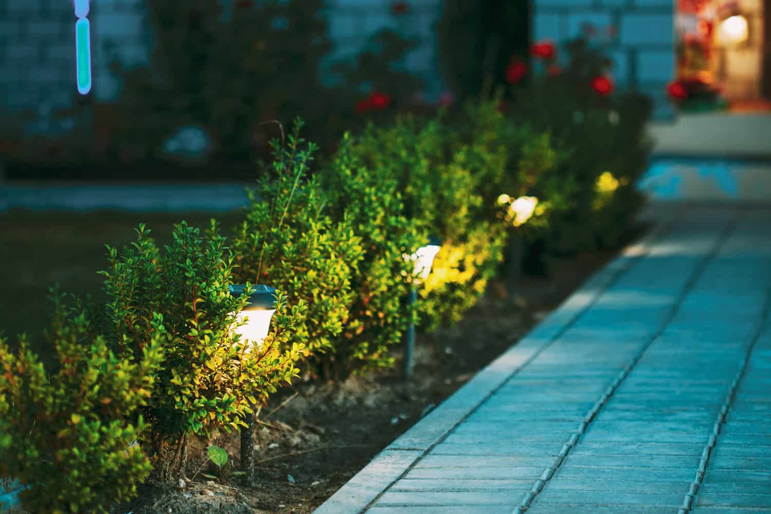 At night solar light outdoor shining beside the pathway stones to the courtyard apartments