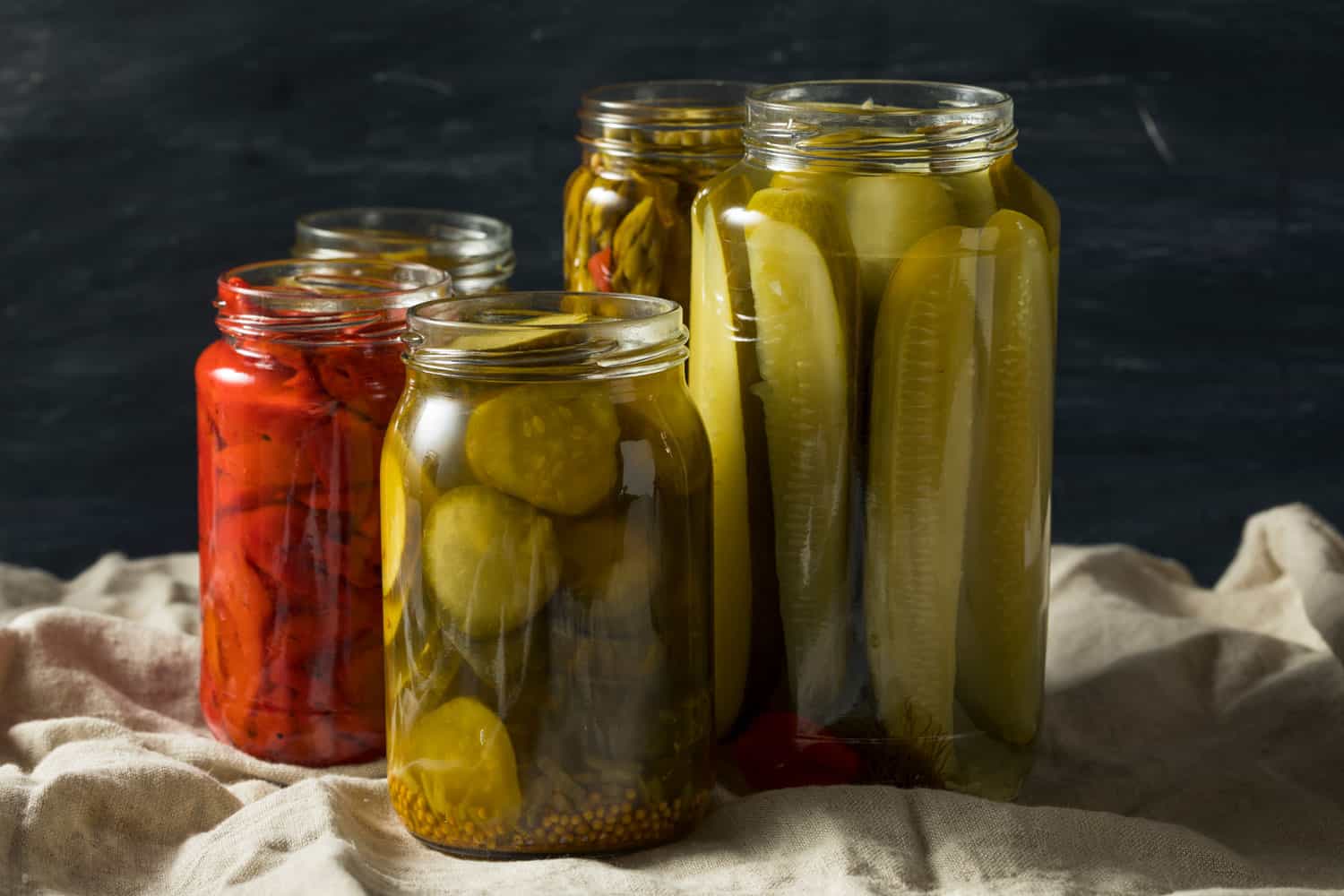 Jars filled with pickles on the table
