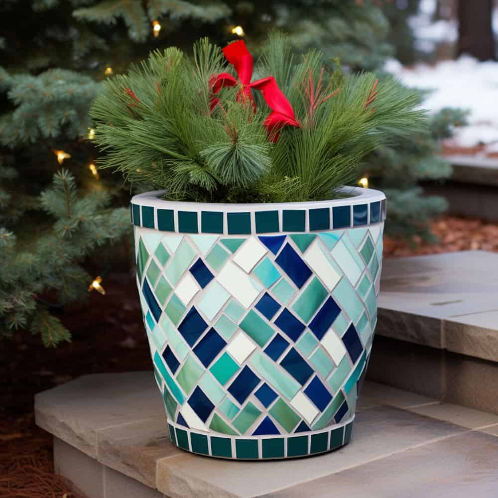 A small mosaic pot with a spruce planted on it