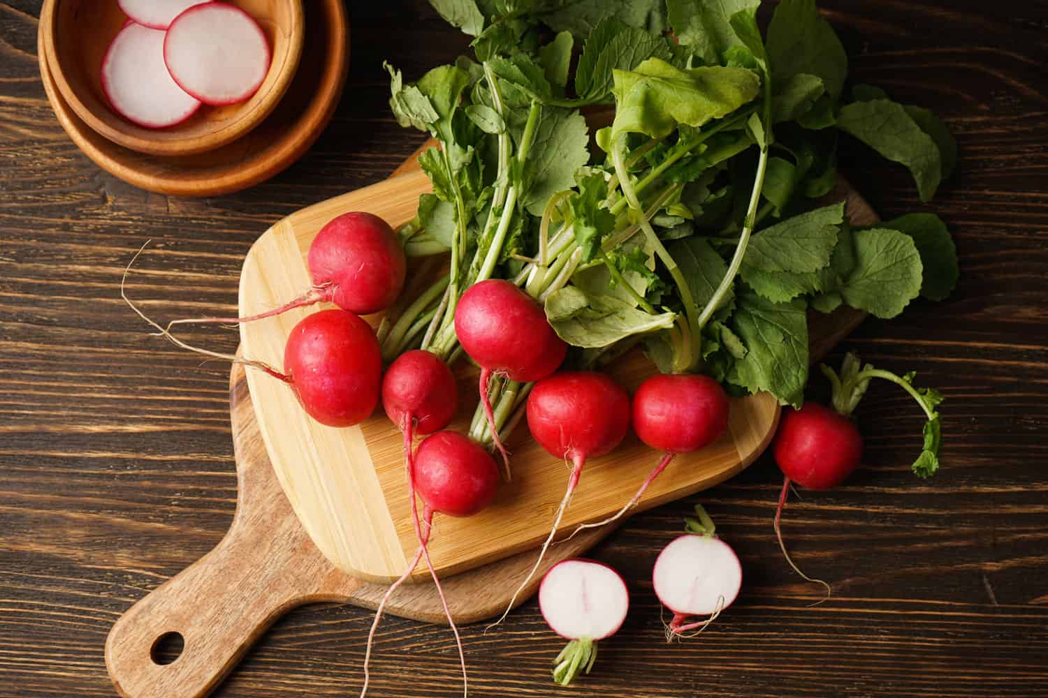 Freshly harvested radishes placed on a chopping board