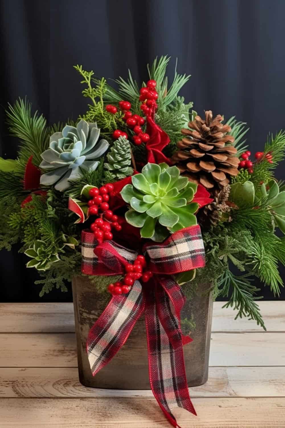 A small mason jar with succulents and other Christmas themed decors